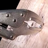 Curved jaw locking plier — 4